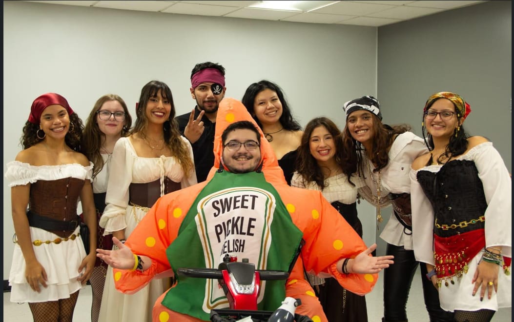 The SAC E-Board posing together in costume at a campus event